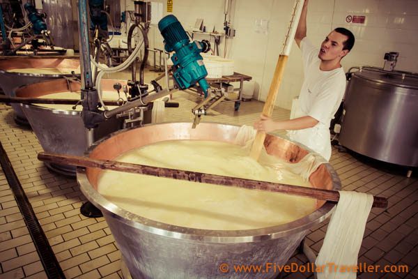 Stirring milk to make parmesan
