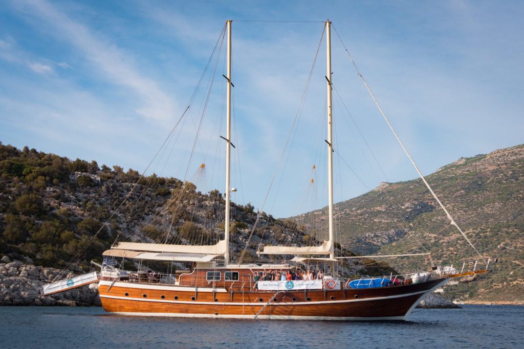 Greek Island Hopping Itinerary: Best Greek Island Hopping Routes: The Sun Fun You Yacht moored off Samiopoula islet