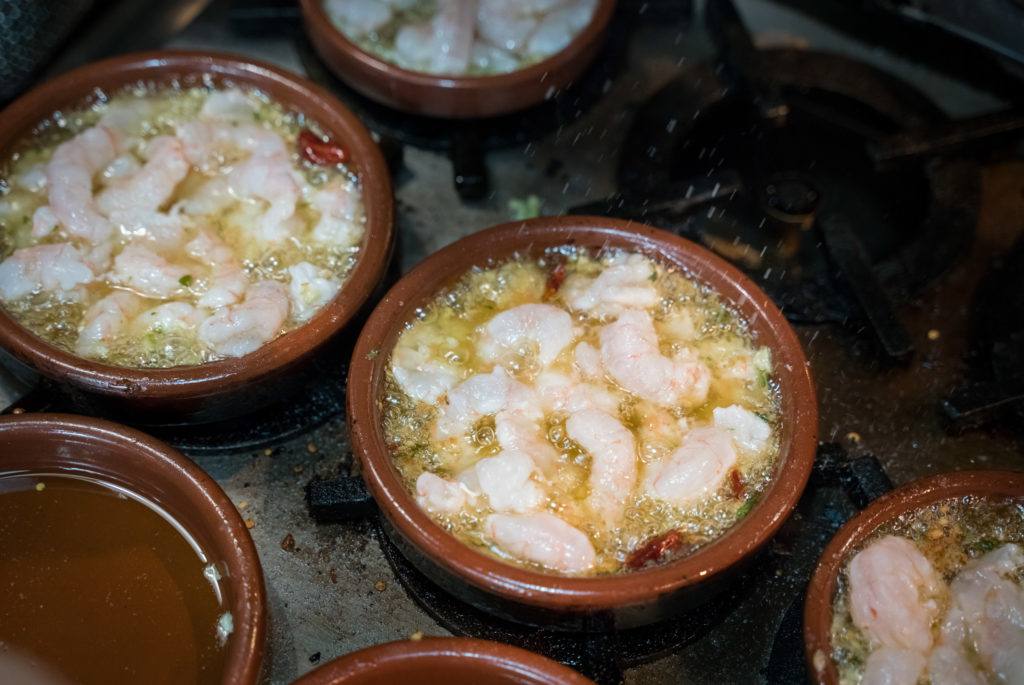 Typical Spanish Tapas Dishes: Gambas al Ajillo - prawns flash fried in lots of garlic laced olive oil