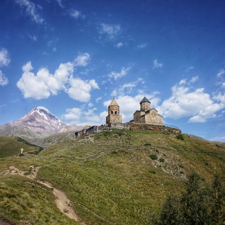 Gergeti Trinity Church against the backdrop of mountains in Kazbegi