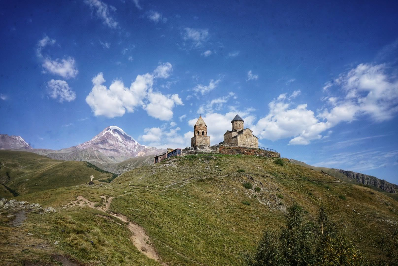 Gergeti Trinity Church against the backdrop of mountains in Kazbegi
